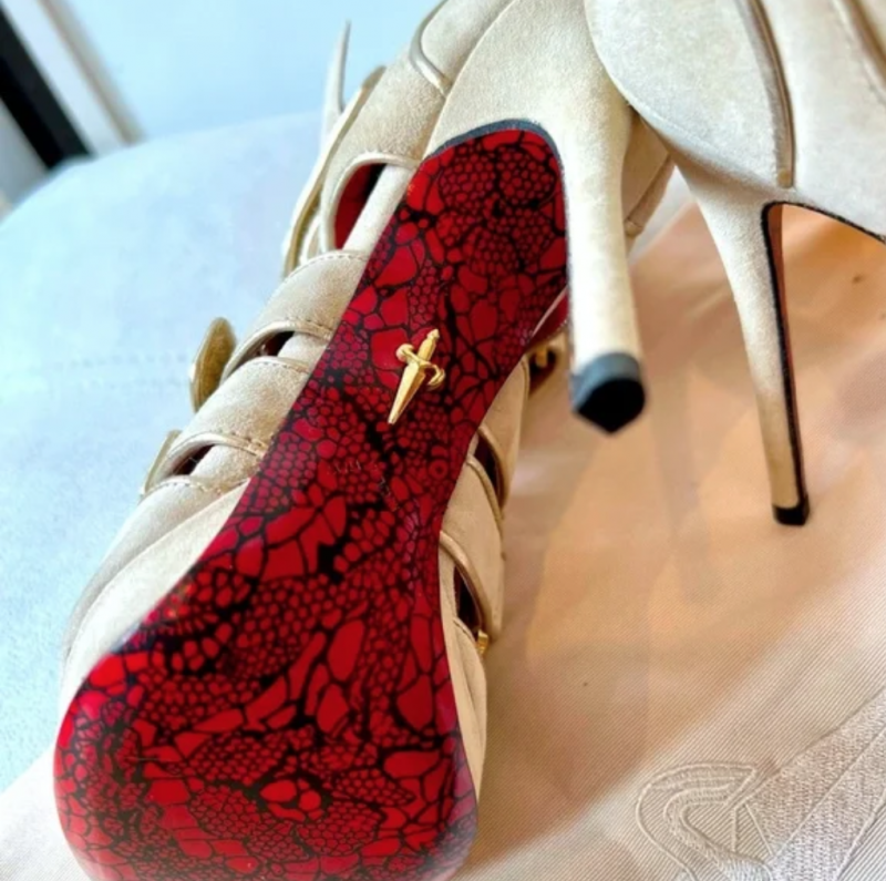 Cesare Paciotti suede high heel sandals showing red sole with iconic dagger motif
